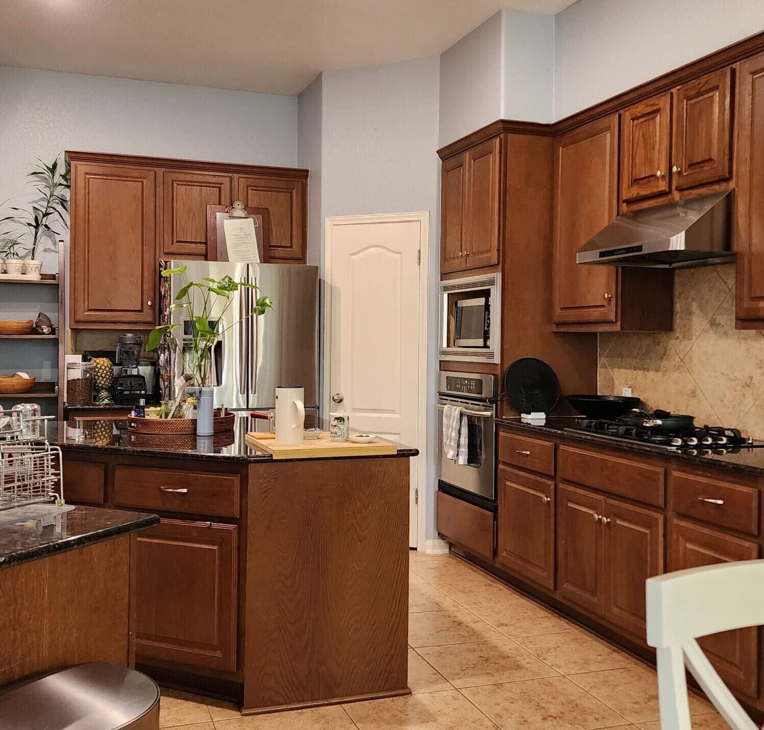 A before kitchen photo showing the old style cabinetry